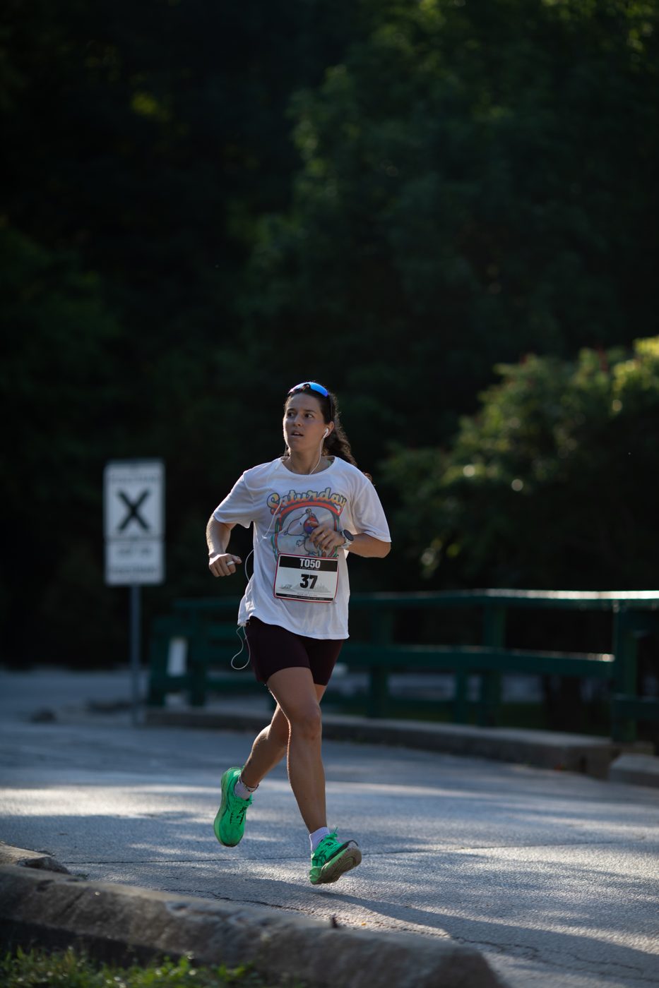 A runner backlit on a Toronto trail during the TO50 50km ultramarathon