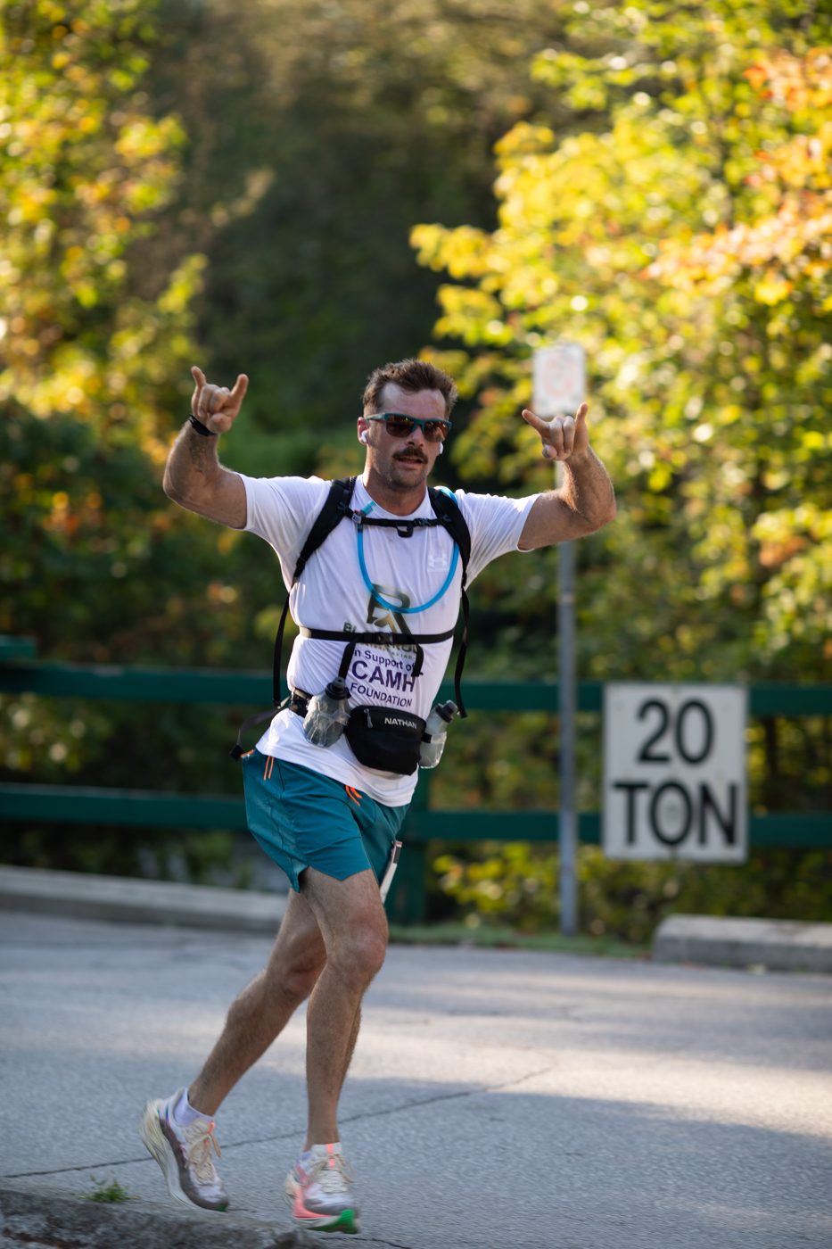 A runner celebrating on the TO50 Toronto ultramarathon course